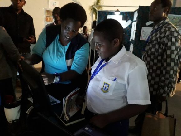 Rachael Kangumba from Leaves Art and Animation studio shows a new animated character to a pupil.